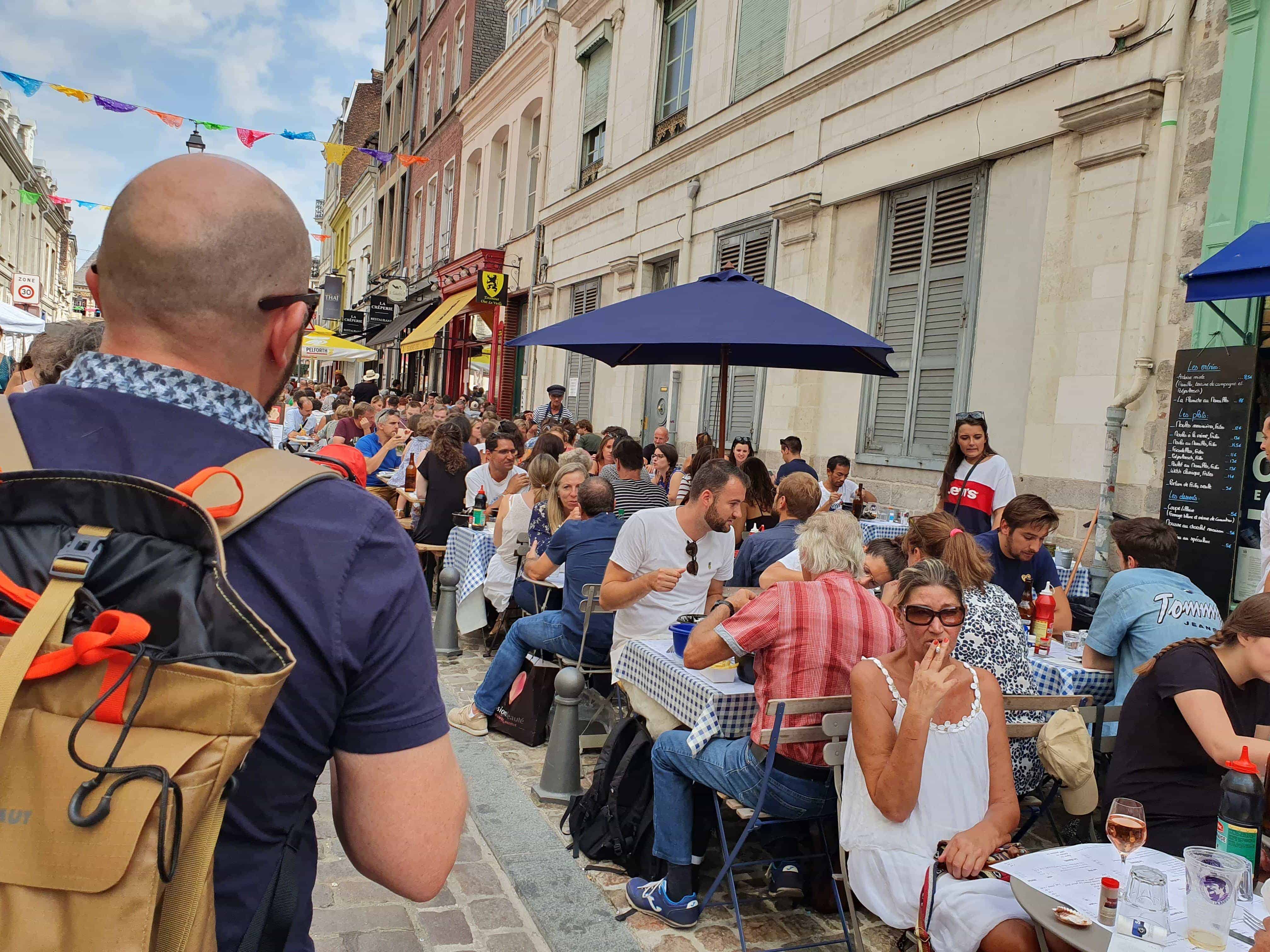 People eating mussels and chips