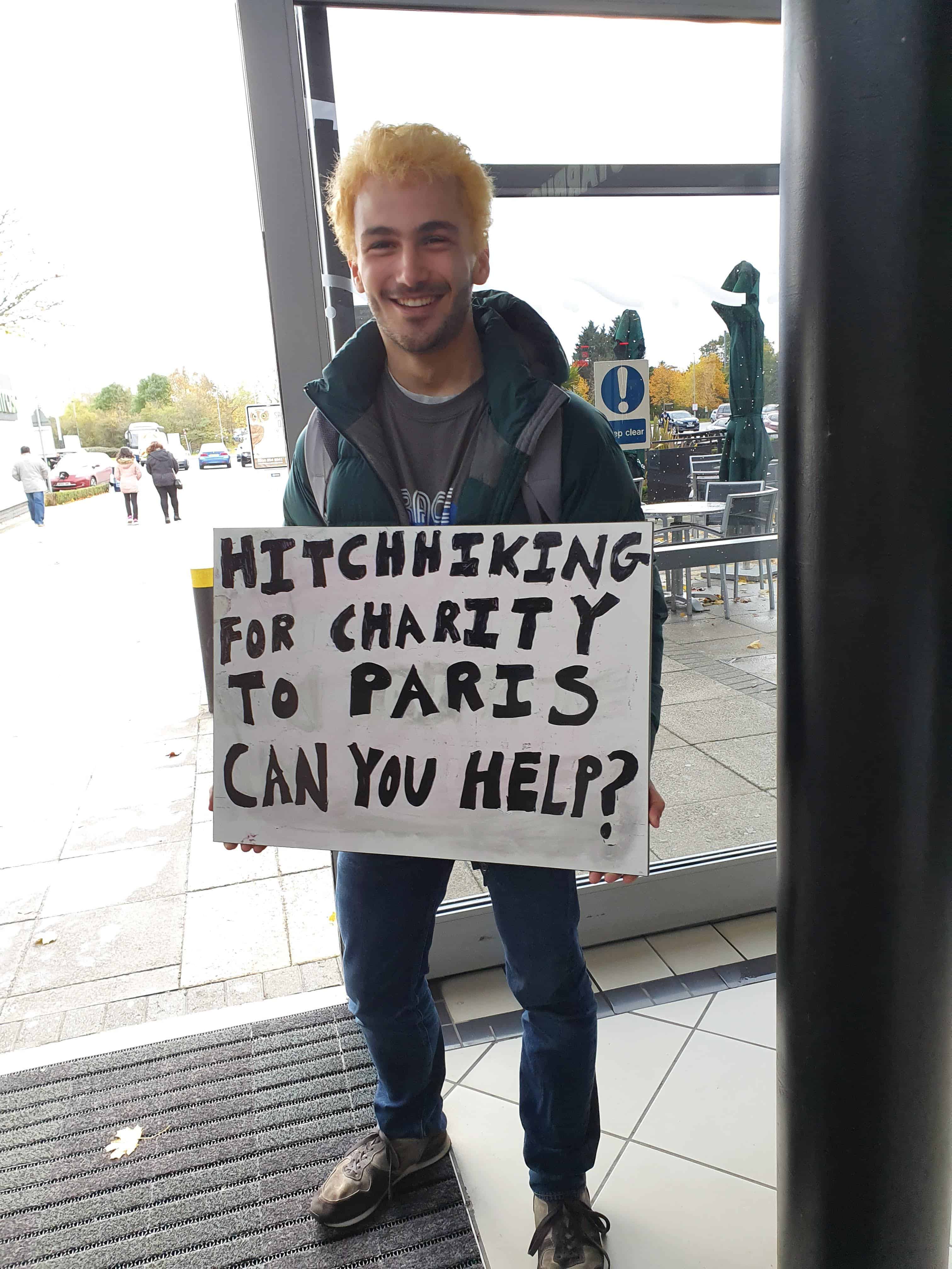 Me with the sign outside of London, with bleached hair